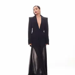 A masterclass in high-fashion power dressing. We paired a strong-shouldered Balenciaga blazer with a delicate sheer skirt for Patralekhaa for a look that is pure editorial.