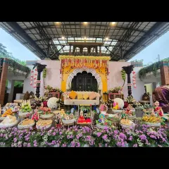 We specialize in creating grand and authentic settings for traditional ceremonies. This elaborate Seemantha (baby shower) setup combines a beautiful floral stage with a full display of traditionally decorated plates, ensuring every detail is perfect.
