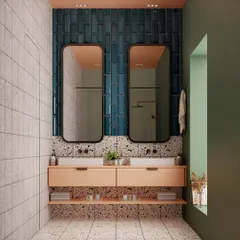 This bathroom design is all about a playful yet polished mix of materials. I blended soft peach cabinetry with deep blue vertical tiles and terrazzo floors. The contrast adds depth, and the green accent wall completes the unique look.