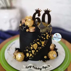 Celebrating a 60th birthday calls for something bold and elegant. This black and gold eggless cake, decorated with Ferrero Rocher chocolates and a custom topper, is a perfect example of a sophisticated design for a major milestone.