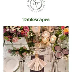 Another view of a stunning tablescape, with a mirrored table reflecting the flowers and candles, creating a magical and luxurious atmosphere.