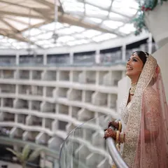 A moment of pure joy for Kanika on her wedding day. Her radiant makeup look was designed to feel light and look flawless from every angle, complementing her stunning ivory and pink lehenga.