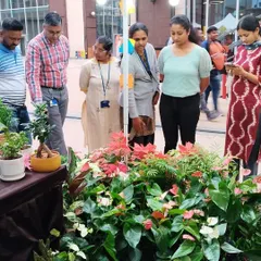 It's wonderful to see so many people interested in bringing plants into their lives. A group of visitors are browsing the selection at my stall during a busy tech fest bazaar.