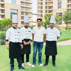 A portrait of our talented chefs. These are the experts who craft the delicious menus and create the culinary magic that makes your event unforgettable. Their passion for food shines through in every dish.