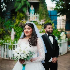 A beautiful candid shot of the bride during her Christian wedding ceremony, with the groom slightly out of focus in the background. This creates a lovely, artistic portrait.