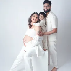 A family eagerly awaiting their newest member. This beautiful maternity portrait captures the love and excitement of the parents and the soon-to-be big brother.