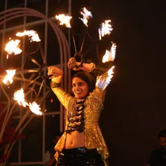 A dynamic shot from one of our regular fire shows at Macaw by Stories. The circular motion of the fire fans creates beautiful trails of light in the dark.