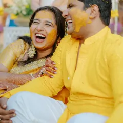 A moment of pure laughter and joy between the bride and groom during their playful Haldi ceremony in Rajasthan.