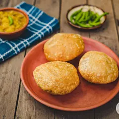 Another look at our signature Kachori and Aloo Sabzi, a perfect weekend brunch. Served with spicy green chillies on the side for that extra kick.