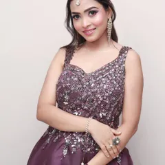A confident pose from a glamour portrait session. The simple studio background ensures that the focus remains entirely on the subject and her attire.