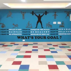 A duplicate of media 4, this installation in a gym uses bold typography and graphics to ask "WHAT'S YOUR GOAL?", motivating clients during their workout.