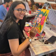 A participant at a Taylor Swift special acrylic painting workshop, fully absorbed in her artwork. These themed events are a huge hit with fans of all ages.