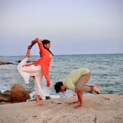 Practicing together by the sea. Here we are, Shreya in Natarajasana and Prashant in Bakasana, sharing a moment of balance and strength. We practice what we teach.
