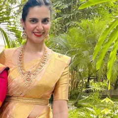 A portrait of elegance. Our client Madhuri looks absolutely regal in her gold Kanjeevaram saree, paired with our custom-designed blouse and matching embroidered belt.