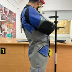 This side profile shows the correct standing posture for 10m Air Rifle. The stability of the body is the platform for a perfect shot, and we spend significant time perfecting this foundation.