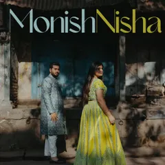 An editorial-style pre-wedding portrait in the old city of Nashik. The contrast between the couple's modern traditional wear and the rustic backdrop creates a unique visual story.