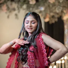 The bride performing during the Sangeet. I capture the movement and expression of dance performances, preserving the energy of the night.
