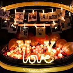 Make it personal by adding your favorite memories. This car trunk setup includes a string of photo clips to display your pictures, alongside marquee letters and romantic lighting.