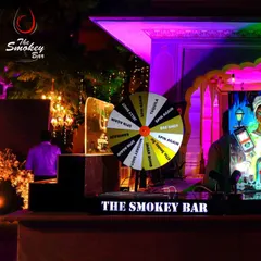 The shot wheel is ready for action at this wedding event. It's a fantastic way to encourage guests to have fun and try different shots, from Tequila to Jager Bombs.