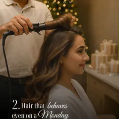 Getting a client ready for a Christmas event. Here, my stylist uses a curling iron to create soft, voluminous waves, a classic look that behaves perfectly for any party.