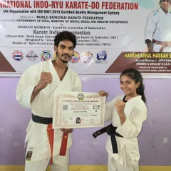 Posing with my student Lekissha and her black belt certificate. As a coach, seeing my students achieve their goals is the greatest satisfaction.