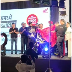 The grand reveal of the new Honda motorcycle, immediately following my sand art performance which set the stage for the launch.