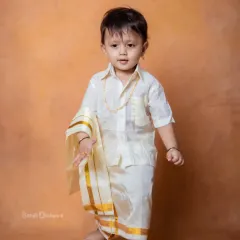 Little feet, big traditions. Draped in love and culture, this little boy is stealing hearts.