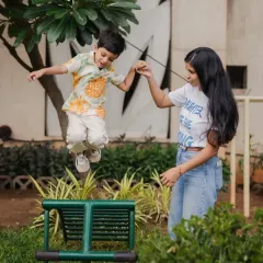 Capturing kids in action is my specialty. This shot of a little boy jumping with his mom's help shows the energy and trust that makes these candid family photos so dynamic and full of life.