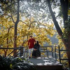 A serene pre-wedding portrait set against a beautiful natural landscape. We use the golden hour light to create a warm and romantic atmosphere for your photos.