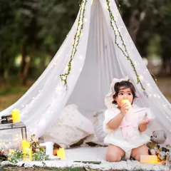 A taste of the birthday magic. Her curiosity and delight are beautifully captured in this candid shot.