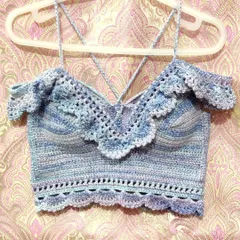 A custom-made 'Masakali' bralette top in a beautiful blue-purple variegated yarn. It features delicate lace details, off-the-shoulder ruffles, and adjustable straps for a perfect, comfortable fit.