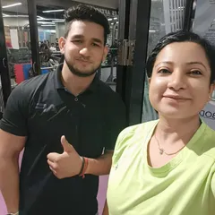 A happy client with her trainer. Her message, "Thank you for making me an improved version of me," is the reason I do what I do.