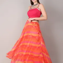 This elegant orange and pink striped lehenga is perfect for festive evenings and graceful dandiya nights. The lightweight fabric and bright colors blend tradition with modern sophistication.
