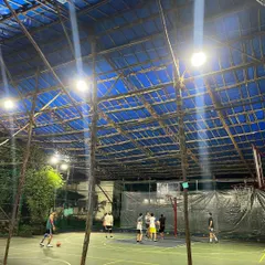 Here's another angle of the court, showing the sturdy structure that keeps it covered and ready for play year-round. Whether you're practicing shots or in a full-court game, the space is all yours.