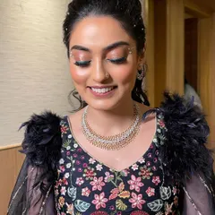 A dreamy Sangeet look. I balanced elegance with playful glam using soft shimmer lids, radiant skin, and pearl detailing in her hair.