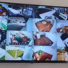 Here is a 16-camera grid view from a large residential installation. I can set up your system so you can see every corner of your property on a single screen, ensuring complete surveillance coverage.