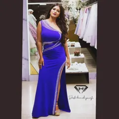 This royal blue gown is all about modern glamour. I designed it with a one-shoulder silhouette and crystal embellishments that trace the curves, finished with a high slit for that perfect power pose.