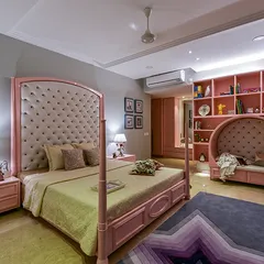 This room proves you can have pink without it being just for a princess. A fairytale four-poster bed and a cozy reading niche make this a dreamy yet functional space where every adventure begins.