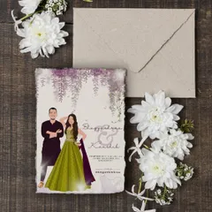 A beautiful flat-lay of a printed engagement invitation card, showing a different outfit and a lovely floral theme. This design can also be used for a welcome board.