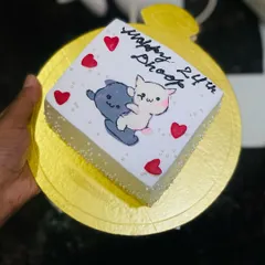 A sweet and personal mini cake with a hand-painted design of two cute cats. This shows how I can create unique, artistic cakes for your special occasions like anniversaries or birthdays.