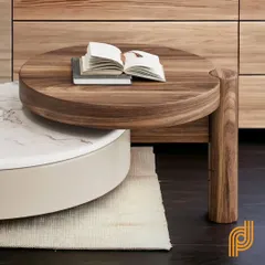 A close-up of the solid walnut wood nesting table, highlighting the beautiful grain and craftsmanship.