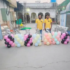 My team and I with custom balloon pillars spelling "BABA SYAM". We are always ready to create custom designs for your special events.