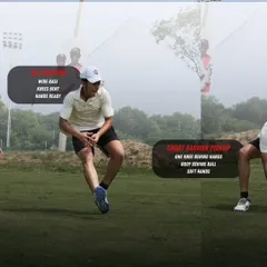 The next phase of the short barrier is the set position and pickup. A wide base for balance, bent knees, and one knee behind the ball ensures you are in a stable position to gather the ball cleanly with soft hands.