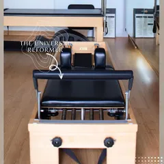 The Universal Reformer is the centerpiece of most Pilates studios for a reason. Its system of springs and pulleys allows for a full body workout that builds strength and improves alignment.