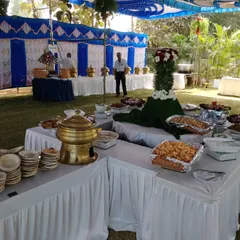 Another view of our extensive outdoor buffet. We use crisp white linens and decorative elements to create an elegant dining experience, no matter the location.