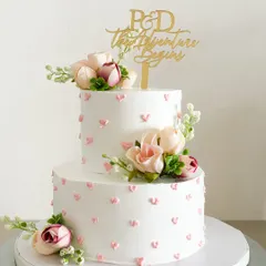 All hearts for this romantic two-tier engagement cake. The simple heart details and fresh flowers create an elegant look, making the beginning of your adventure even sweeter.