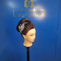 Practice makes perfect. In my classes, we use mannequin heads to master different techniques, from intricate Christian bridal updos and Russian flower buns to sleek Bollywood ponytails.