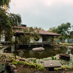 The view from our studio, overlooking the pond. The round window frames the natural beauty, bringing a sense of calm and connection to the outdoors into our practice space.