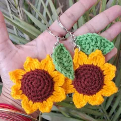Bright and sunny sunflower crochet keychains. These little tokens of appreciation are handmade with love and are a wonderful way to brighten someone's day.