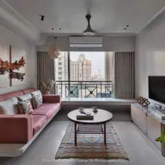 This living room is all about handmade craft. The floating concrete-finish sofa base, custom artwork, and unique rug come together to create a space that feels truly one-of-a-kind.